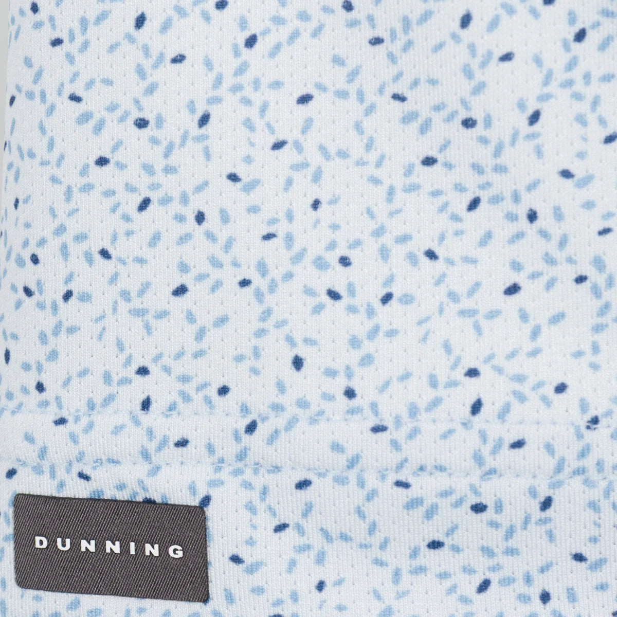 Textured Cashmere Blue fabric with blue and black speckles and 'Dunning' brand label.