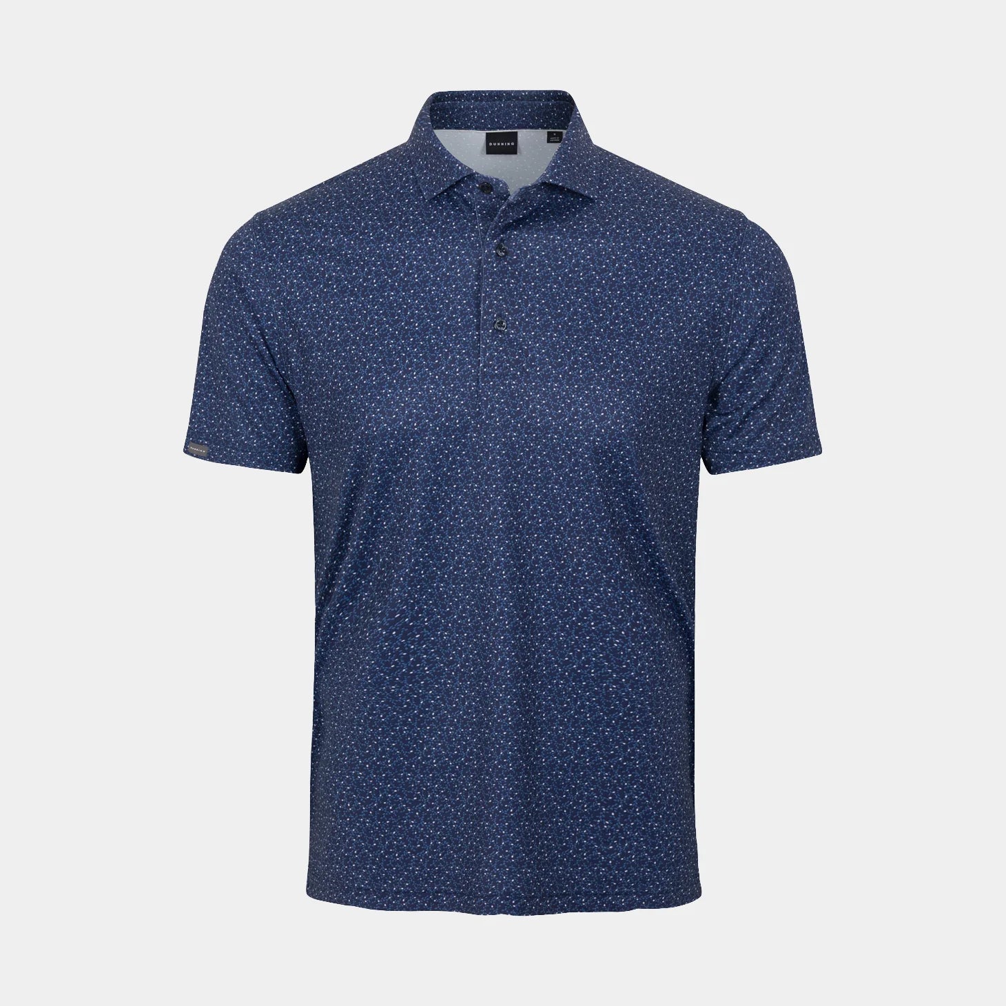 A short-sleeve polo shirt in dark Halo blue with a dense, small white micro-pattern across the entire fabric, shown on a light gray background.
