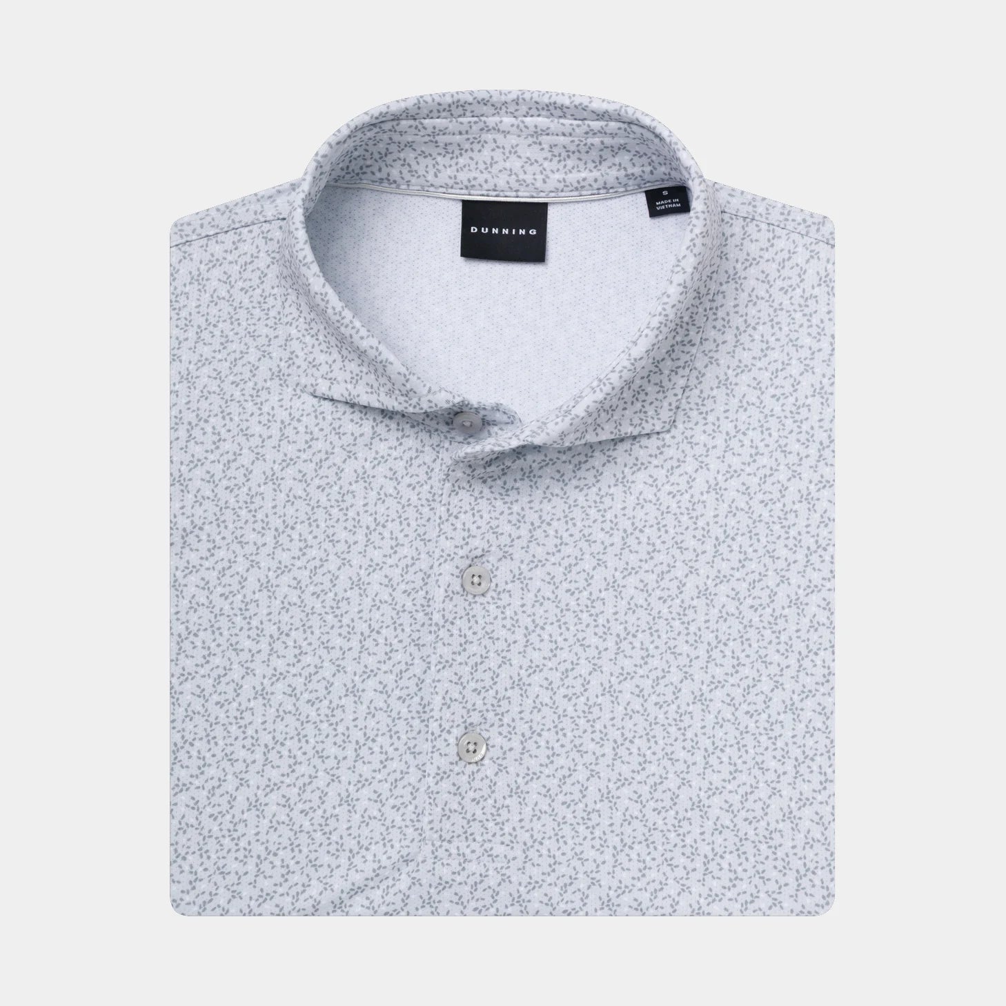 A folded light Micro-Chip gray and white micro-patterned polo shirt with a collar and button placket, shown on a plain light gray background.