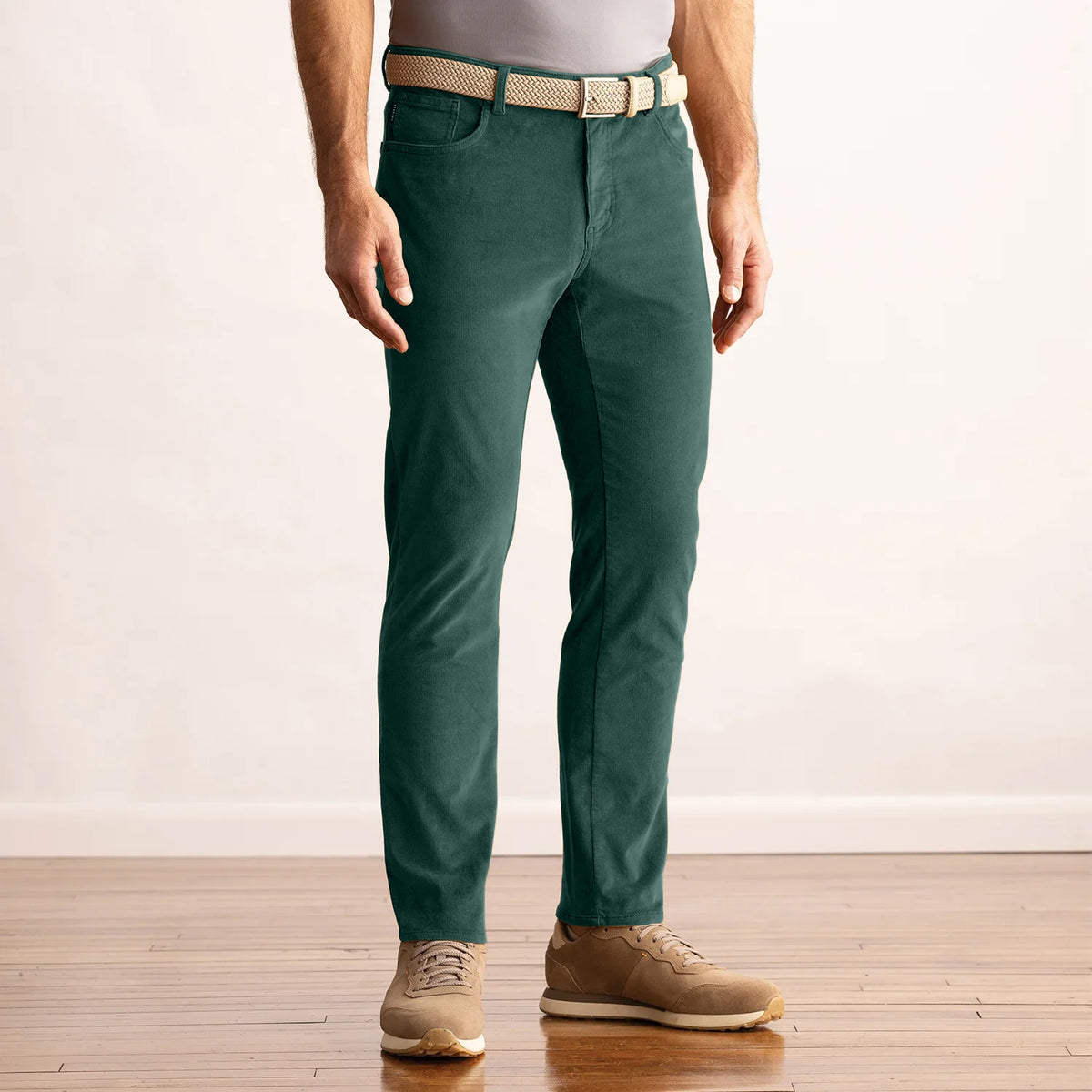 Model wearing the Dunning Seabury Corduroy Performance Pant in Poker Green, front view.