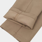 Close-up of the rolled hem showing the lining of the Dunning Precision Insulated Pant in Dark Khaki.