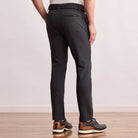 Model wearing the Dunning Precision Insulated Pant in Black, back view.